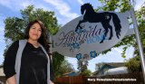 Josette Bejarano was once addicted to opioids. Here, since recovered, she's at Amanda's Home, a Champions site for adult females struggling with substance abuse. The sign was built and donated by Lemoore's Northland Process Piping NPP.